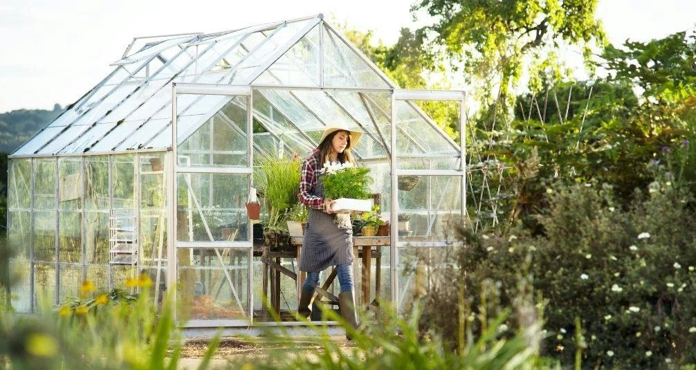 The Benefits of the Great Outdoors woman gardening in greenhouse